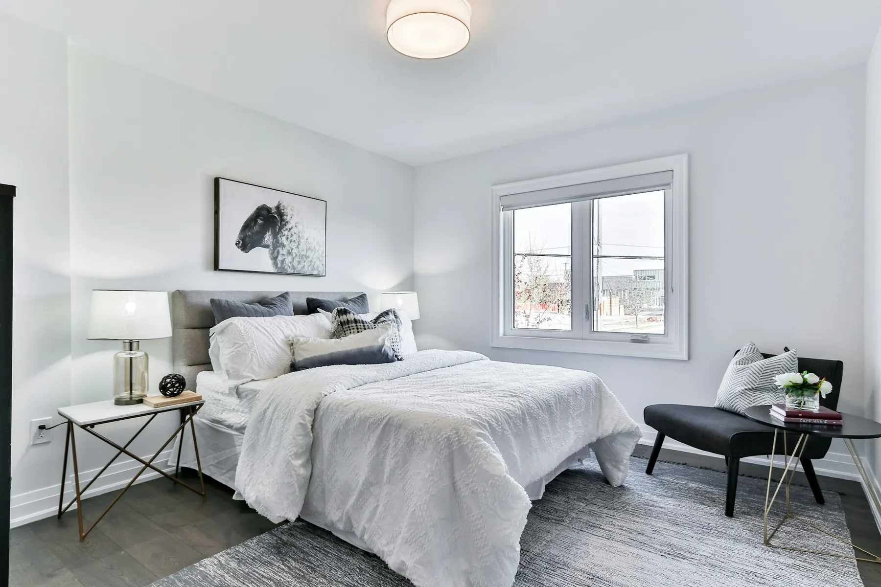 Bright bedroom with white linen