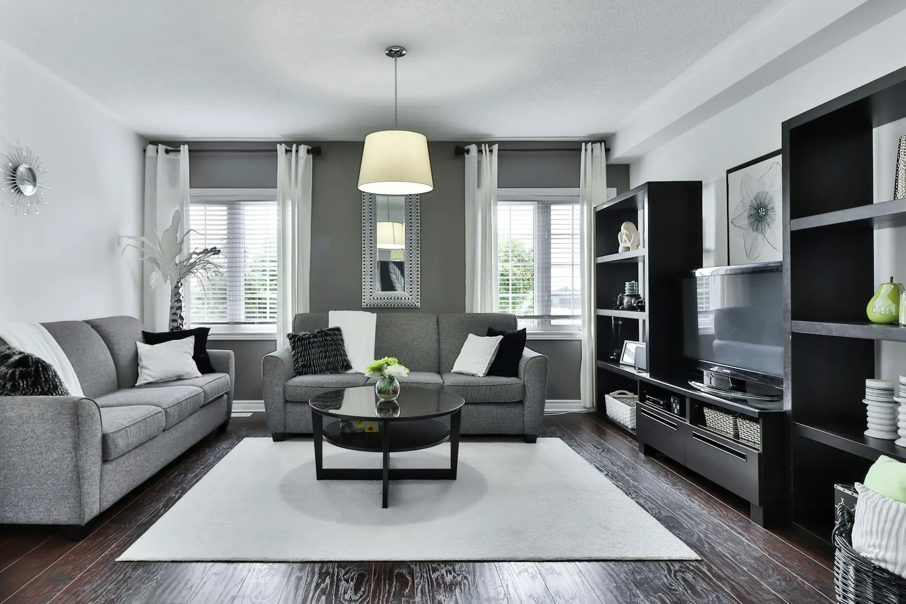 Contemporary lounge with grey sofas and a rug